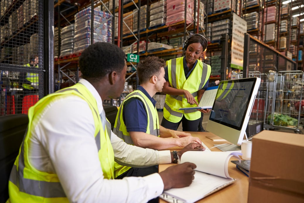 Team Discussing Warehouse Logistics in an on-Site Office